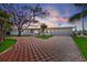 Charming ranch home with a checkered brick driveway and mature landscaping at 485 41St Ave, St Pete Beach, FL 33706