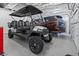 Garage with golf cart and SUV, offering ample storage space at 485 41St Ave, St Pete Beach, FL 33706