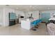 Modern kitchen featuring white shaker cabinets, quartz countertops, and teal appliances at 485 41St Ave, St Pete Beach, FL 33706