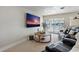 Relaxing living room with large screen TV and access to waterfront patio at 485 41St Ave, St Pete Beach, FL 33706