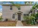 Townhome's front entrance with landscaping and walkway at 5230 Blue Roan Way, Wesley Chapel, FL 33544