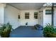 Back porch with gray deck and potted plants at 215 35Th Ne Ave, St Petersburg, FL 33704