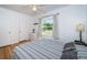 Cozy bedroom with wood floors, large window, and ample closet space at 215 35Th Ne Ave, St Petersburg, FL 33704