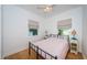 Second bedroom with hardwood floors and neutral decor at 215 35Th Ne Ave, St Petersburg, FL 33704