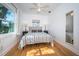 Bright bedroom with hardwood floors and large window at 215 35Th Ne Ave, St Petersburg, FL 33704