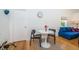 Small dining area with round table, black chairs, and hardwood floors at 215 35Th Ne Ave, St Petersburg, FL 33704