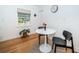 Small dining area with a round table and two black chairs at 215 35Th Ne Ave, St Petersburg, FL 33704