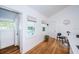 Kitchen features white cabinets, marble countertops, and a small dining area at 215 35Th Ne Ave, St Petersburg, FL 33704