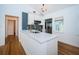 Modern kitchen with white cabinets, marble countertops, and gold hardware at 215 35Th Ne Ave, St Petersburg, FL 33704