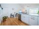 Kitchen with white cabinets, marble countertops, and a breakfast nook at 215 35Th Ne Ave, St Petersburg, FL 33704