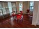 Bright dining area with hardwood floors and a glass-top table at 1182 Norwood Ave, Clearwater, FL 33756