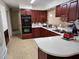 Well-equipped kitchen with ample counter space and dark wood cabinets at 1182 Norwood Ave, Clearwater, FL 33756