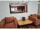 Living room with hardwood floors and a kitchen pass-through at 1182 Norwood Ave, Clearwater, FL 33756