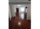 Open living area with hardwood floors and a view of the kitchen at 1182 Norwood Ave, Clearwater, FL 33756