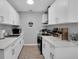 Modern kitchen with white cabinets, new appliances, and quartz countertops at 463 Park N St, St Petersburg, FL 33710
