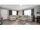 Living room with new flooring and ample natural light at 463 Park N St, St Petersburg, FL 33710