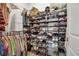 Well-organized closet with hanging rods and shelving at 9921 Pier Point Ter, Parrish, FL 34219