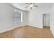 Bright bedroom with wood-look tile floors and a walk-in closet at 11305 Sweet Bay Ct, Riverview, FL 33569