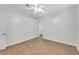 Simple bedroom with wood-look tile floors and a walk-in closet at 11305 Sweet Bay Ct, Riverview, FL 33569