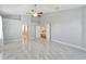 Spacious bedroom with large tile floors and access to a bathroom at 11305 Sweet Bay Ct, Riverview, FL 33569