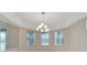 Bright dining room with large windows and a chandelier at 11305 Sweet Bay Ct, Riverview, FL 33569