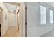 Clean hallway with tile floors and access to other rooms at 11305 Sweet Bay Ct, Riverview, FL 33569