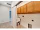 Laundry room with upper cabinets and a utility sink at 11305 Sweet Bay Ct, Riverview, FL 33569