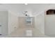 Bright living room featuring tile floors and a ceiling fan at 11305 Sweet Bay Ct, Riverview, FL 33569