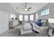 Main bedroom with large bed and stylish decor at 11305 Sweet Bay Ct, Riverview, FL 33569