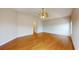 Spacious bedroom with hardwood floors, high ceilings, and an arched doorway at 17929 Timber View St, Tampa, FL 33647
