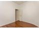 Bedroom with hardwood floors, white walls, and a doorway leading to another room at 17929 Timber View St, Tampa, FL 33647