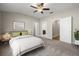 Bright bedroom with carpeted floors and ensuite bathroom at 2418 Foggy Creek Cir, Clearwater, FL 33764