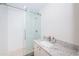 Updated bathroom with a large walk-in shower and granite countertop at 4993 Bostonian Loop # 4993, New Port Richey, FL 34655