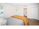 Spacious bedroom with wood-look floors and ensuite bathroom at 4993 Bostonian Loop # 4993, New Port Richey, FL 34655