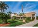 Community clubhouse with landscaping and flag at 4993 Bostonian Loop # 4993, New Port Richey, FL 34655
