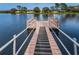 Wooden community dock with benches and railings over the water at 4993 Bostonian Loop # 4993, New Port Richey, FL 34655