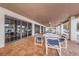 Covered patio with tables and chairs near pool at 4993 Bostonian Loop # 4993, New Port Richey, FL 34655
