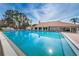 Inviting community pool with surrounding lounge chairs at 4993 Bostonian Loop # 4993, New Port Richey, FL 34655