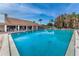 Inviting community pool with surrounding lounge chairs at 4993 Bostonian Loop # 4993, New Port Richey, FL 34655
