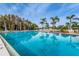 Inviting community pool with surrounding lounge chairs at 4993 Bostonian Loop # 4993, New Port Richey, FL 34655