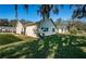 Tan house exterior with large windows and grassy yard at 4993 Bostonian Loop # 4993, New Port Richey, FL 34655
