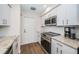 Modern kitchen with stainless steel appliances and granite countertops at 4993 Bostonian Loop # 4993, New Port Richey, FL 34655