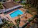 Overhead view of resort-style pool, patio, and lounge area at 4993 Bostonian Loop # 4993, New Port Richey, FL 34655