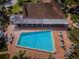 Community pool with surrounding lounge chairs and patio at 4993 Bostonian Loop # 4993, New Port Richey, FL 34655