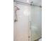 Large walk-in shower with glass enclosure and hexagon tile floor at 4993 Bostonian Loop # 4993, New Port Richey, FL 34655