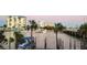 Picturesque waterfront view showcases the docks, bay, and high-rise condos in a coastal community at 9415 Blind Pass Rd # 905, St Pete Beach, FL 33706