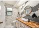 Modern bathroom with hexagon tile and floating vanity at 2383 Indian E Trl, Palm Harbor, FL 34683