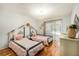 Charming bedroom with two twin beds and wood floors at 2383 Indian E Trl, Palm Harbor, FL 34683