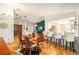 Open concept dining area with hardwood floors and kitchen view at 2383 Indian E Trl, Palm Harbor, FL 34683