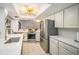 Modern kitchen with stainless steel appliances and white cabinets at 2383 Indian E Trl, Palm Harbor, FL 34683